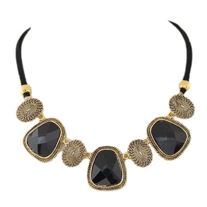Collier rétro doré avec pierres noires facettées et accents ovales à texture spirale