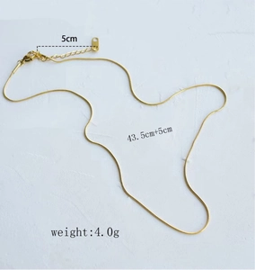 Detail of gold snake bone chain necklace with dimensions 43.5cm length and lobster clasp