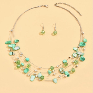 Bohemian multilayer necklace and earrings set with green crystal beads and shell charms