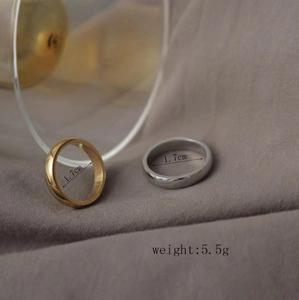 Detail showing 1.7cm inner diameter and 5.5g weight of polished stainless steel rings