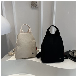Minimalist waterproof nylon multi-functional tote bag with round metal brand logo detail