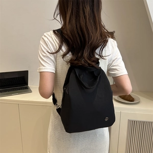 Chic black nylon backpack for women, minimalist design for casual and daily commute