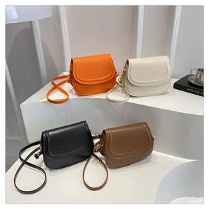 Minimalist saddle bags in orange, white, black and brown with elegant gold metal buckles