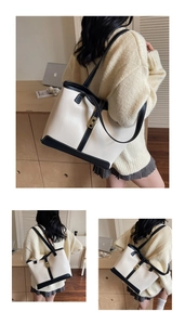 Vue détaillée du grand sac cabas bicolore avec bordures noires et fermoir doré chic