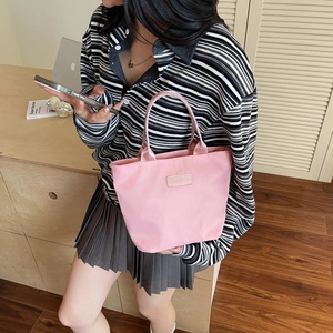 Pale pink waterproof nylon tote handbag for women, fashion casual lightweight daily commuter bag