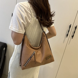 Brown herringbone weave large tote bag with decorative zipper for summer beach vacations