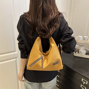 Chic mustard yellow hobo tote bag with diagonal metal zipper and leather brand patch