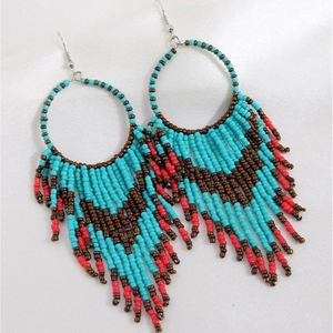 Bohemian beaded tassel hoop earrings featuring blue brown and red ethnic woven patterns