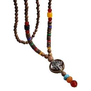 Sautoir ethnique perles en bois et pendentif Ganesha éléphant argenté pour femme chic