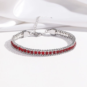 Detail of silver chain bracelet with double row of red zircon and adjustable lobster clasp