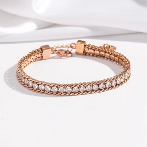 Detail of rose gold bracelet with cubic zirconia inlay and adjustable link extension