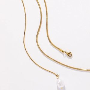Minimalist gold snake chain necklace with a lustrous white baroque pearl pendant