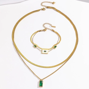 Double layered gold titanium necklace and bracelet set with emerald green zircon pendants