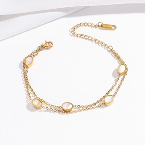 Gold double-layer stainless steel bracelet with oval shell charms and adjustable clasp