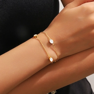 Chic gold layered bracelet with shell charms on double chain links for women