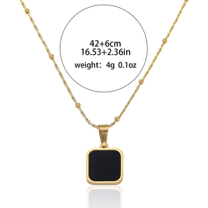 Minimalist geometric square pendant necklace in gold-plated steel with black enamel inlay