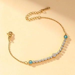 Elegant gold titanium steel bracelet for women with blue crystals and zircon stones