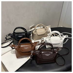 Minimalist mini leather satchel in five colors with glossy and matte finishes