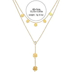 Layered gold clover necklace with heart crystal pendant and Y-shaped chain design