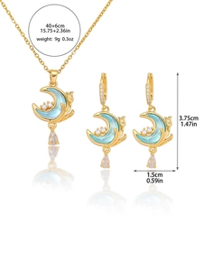 Detail view of cat moon jewelry set showing dimensions and light blue stone accents