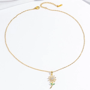 Gold sunflower necklace with crystal petals and green leaf pendant on a thin link chain