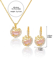 Detailed size view of golden mermaid tail necklace and butterfly earrings set