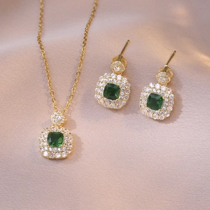 Titanium steel jewelry set with emerald cut green zircon pendants and halo stones