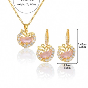 Pink mermaid tail jewelry set with gold necklace and matching butterfly earrings