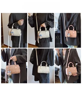Detail shots of mini Boston bag with embossed cartoon bear and rabbit patterns