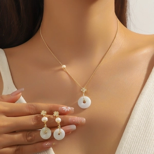 Elegant jewelry set with freshwater pearl and emerald flower necklace and earrings