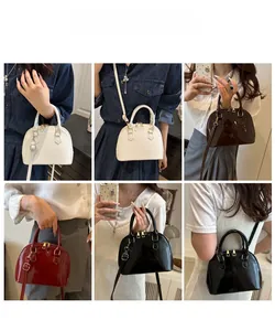 Classic shell-shaped patent leather handbag shown in white, brown, burgundy, and black