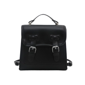 Sac à dos minimaliste en similicuir noir avec nœuds décoratifs et boucles argentées
