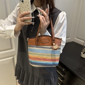 Rainbow striped straw woven handbag with brown leather trim and stylish crossbody design