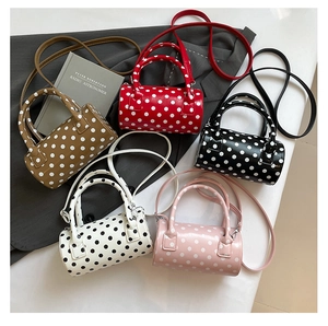 Polka dot cylindrical mini bags in five colors with smooth leather and silver zippers