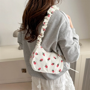 White corduroy strawberry print underarm bag with a stylish ruched scrunchie shoulder strap