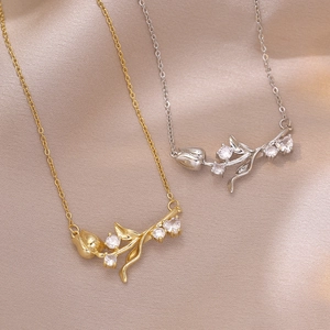 Elegant tulip pendant necklace in gold and silver finish with white zircon crystals