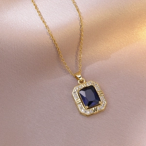 Vintage style gold titanium necklace featuring a rectangular navy blue zircon pendant