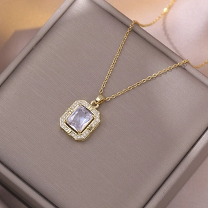 Vintage gold titanium necklace with emerald-cut zircon pendant and halo crystal setting