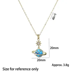 Golden planet necklace with blue enamel pendant featuring moon and star decorations