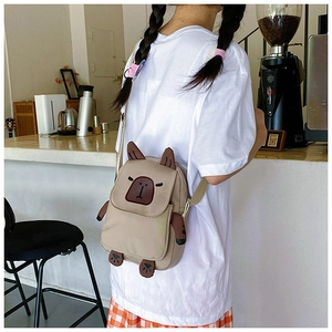 Detail view of a cute khaki capybara crossbody bag with adjustable nylon shoulder strap