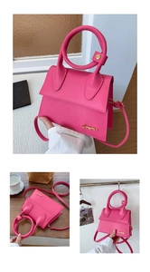 Detailed macro view of the circular gold handle and magenta PU leather texture on the bag