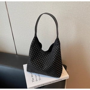 Detail shot of a black hobo shoulder bag featuring shimmering silver rhinestones