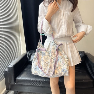 Floral canvas tote bag with purple plaid straps and bow details for women