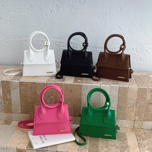 Mini trapezoid handbags with round handles in five colors including black and green