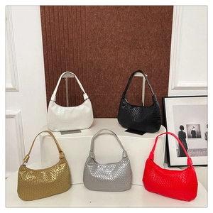 Collection of chic hobo bags in snake texture with various colors on elegant stands
