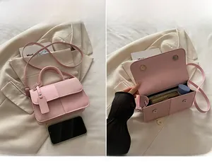 Pink PU leather handbag detail showing woven texture patchwork and spacious inner storage