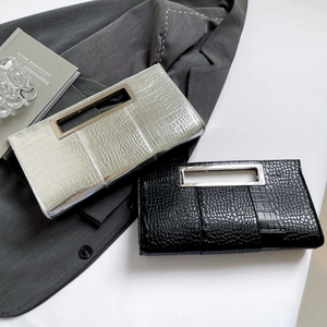 Chic faux crocodile leather clutches in silver and black with stylish metal handles