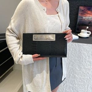 Elegant black crocodile-patterned envelope clutch bag with sleek metal handle for women