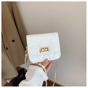 Detail of white quilted mini crossbody bag with gold twist lock and chain strap