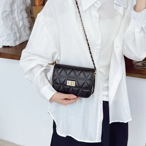 Classic quilted crossbody bag in black with gold chain strap and metal swivel lock